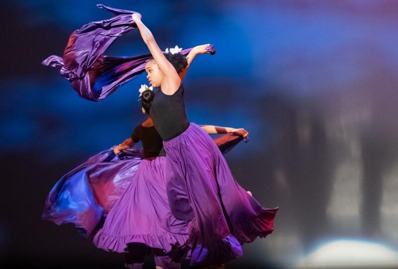 A student performing on stage